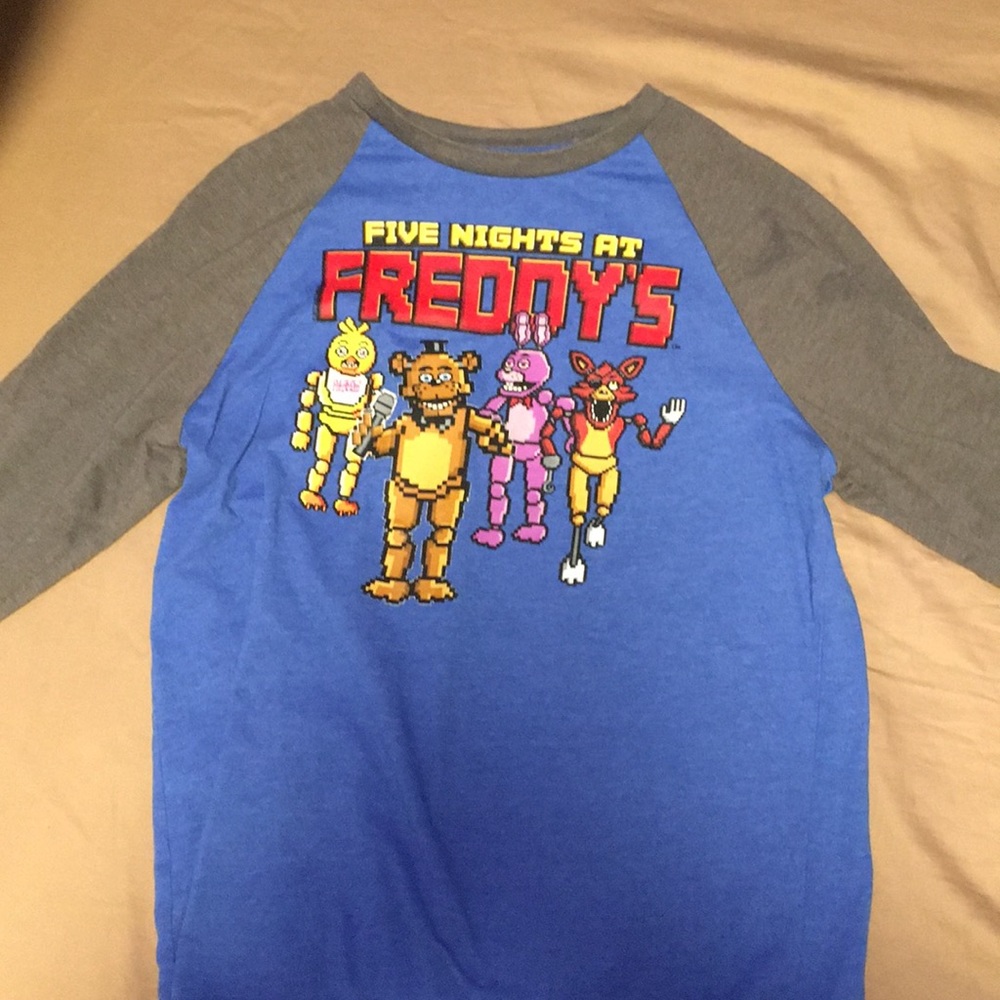 I’m selling 2 long sleeve shirts with FNAF on them